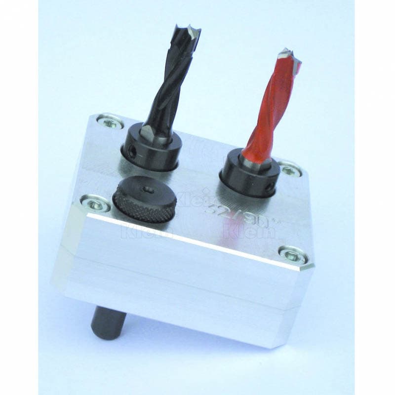 Drilling jig for making holes for hinge inserting schema
